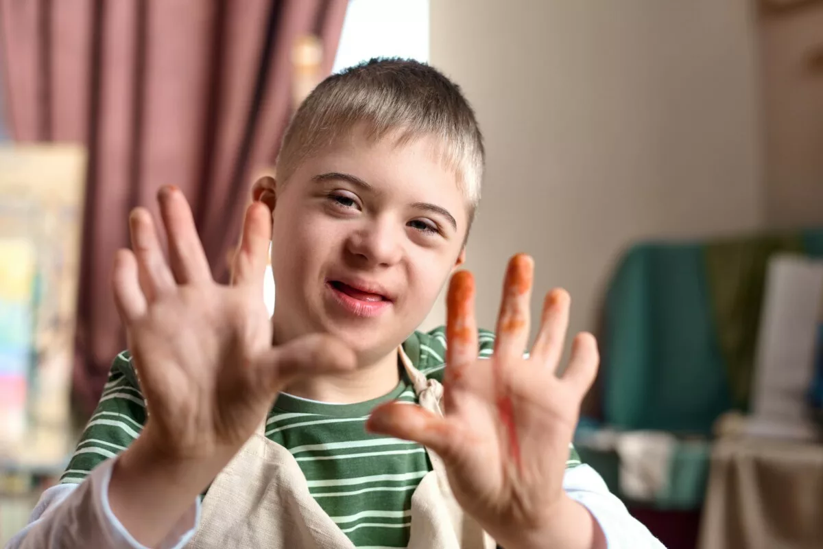 Close up teenage boy with down syndrome showing ha 2025 03 18 22 19 46 utc min