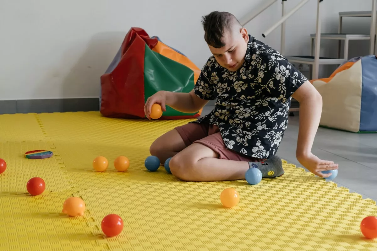Disabled child doing sensory activity with toys r 2025 03 09 17 44 42 utc min