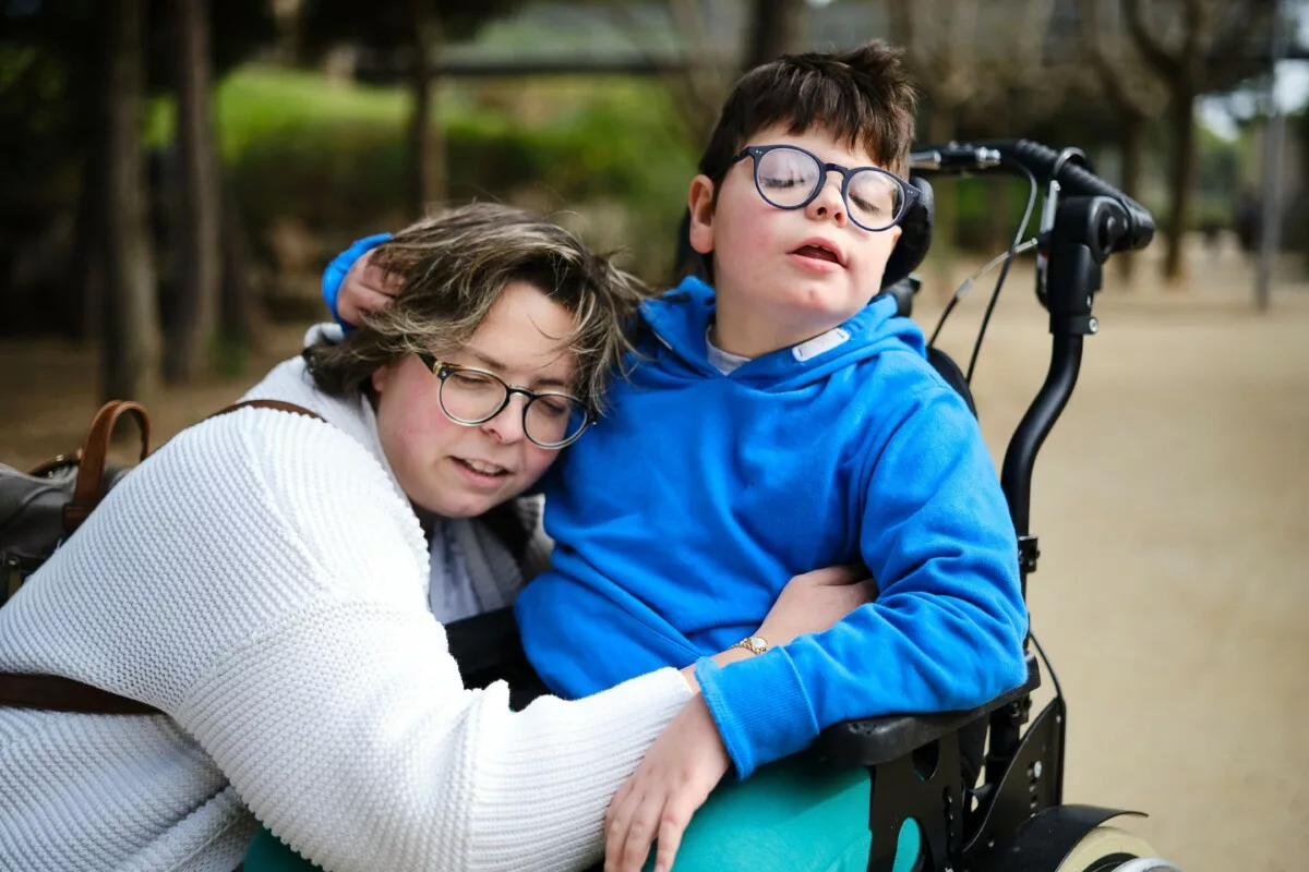 Mother hugging her disabled son in a wheelchair wh 2025 04 02 09 14 43 utc min